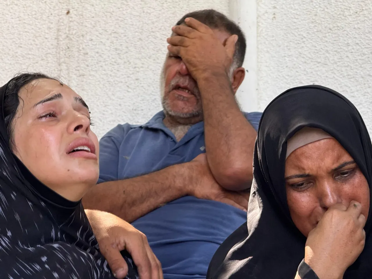 As Israel turns its focus to Iran, the death toll mounts in Gaza — and hunger deepens 3 A family mourns a young man killed by Israeli forces while trying to get a sack of flour off U.N. aid trucks entering northern Gaza on Saturday, June, 14, 2025.