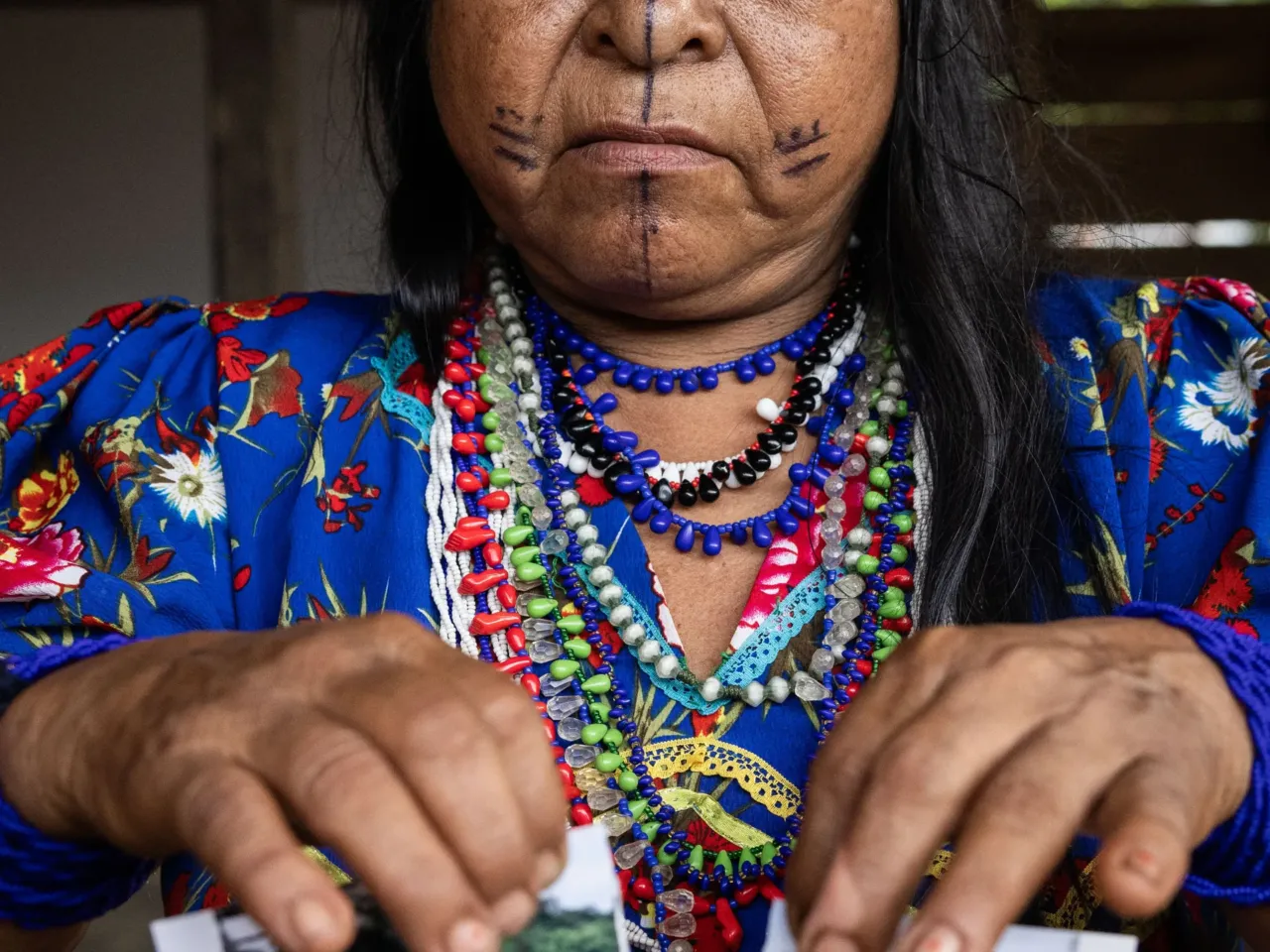 Photos: How torn pictures and trusted herbs create healing in Colombia 2 Traditional midwife Rogelina Arce Campo takes part in a newly created ritual to cope with the armed conflict in their part of Colombia. She tore an image of a place that has suffered from the violence, then used herbs and sutures to symbolically heal it.