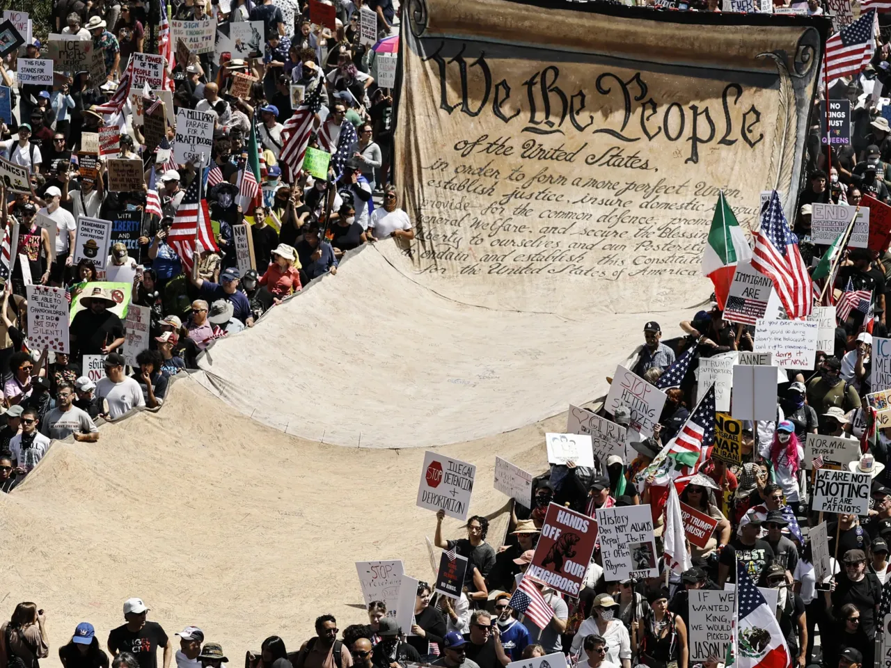 The story behind the arrest of 87-year-old veteran John Spitzberg at the Capitol 2 Protesters carry a banner representing the preamble to the U.S. Constitution in downtown Los Angeles during an anti-Trump No Kings Day demonstration on June 14.