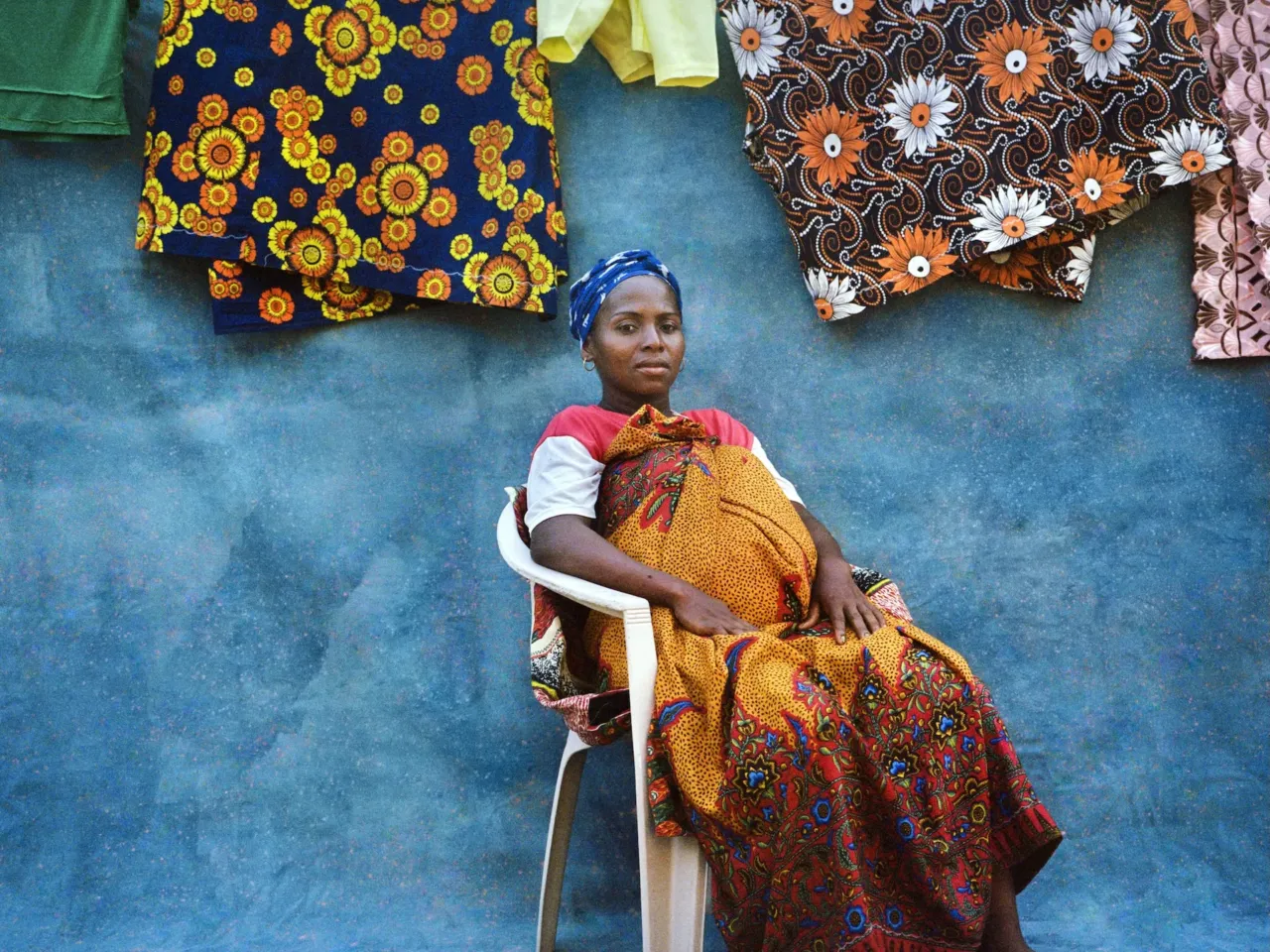 Photos: Why it took courage for these women to pose for the camera 2 A portrait of Julie Moanariziky, who had contracted female genital schistosomiasis. The photographer posed her in front of a canvas painted blue, to symbolize water, with white dots representing the parasitic worms that spread the infection.