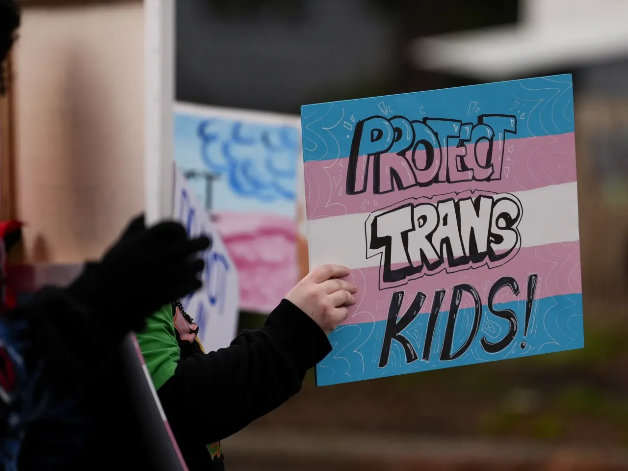 He sued for marriage equality and won. 10 years later, he fears for LGBTQ+ rights 2 A person holds a sign during a pro-transgender rights protest outside of Seattle Children's Hospital after the institution postponed some gender-affirming surgeries for minors following an executive order by President Donald Trump, Sunday, Feb. 9, 2025, in Seattle.