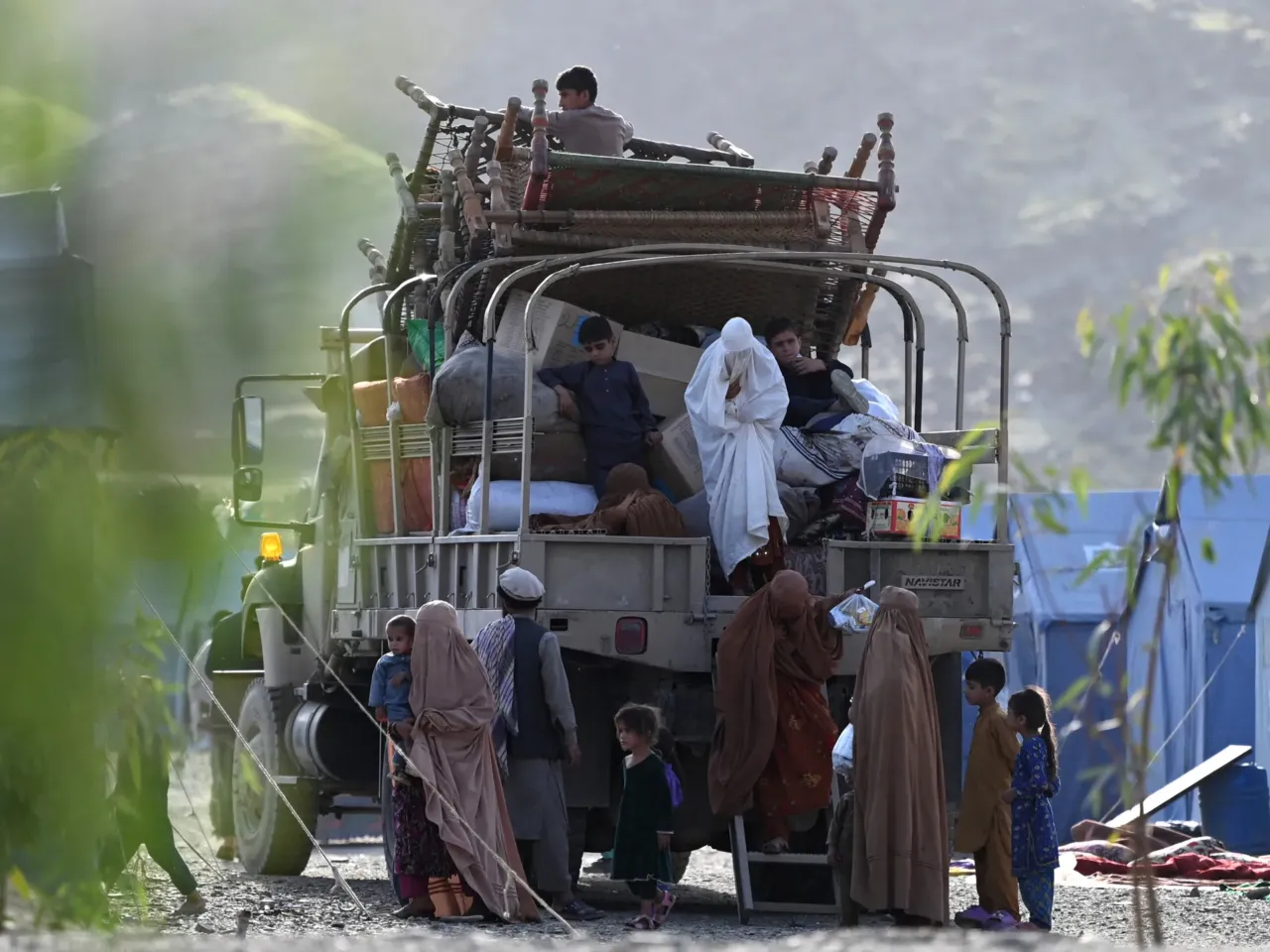 Hard to imagine a worse time to deport Afghan refugees, human rights advocates say 1 Afghan refugees climb down from a truck after arriving from Pakistan near the Torkham border with Afghanistan. Pakistan has launched a campaign to evict hundreds of thousands of Afghans who have had their residence permits canceled, including some who were born in Pakistan or lived there for decades.