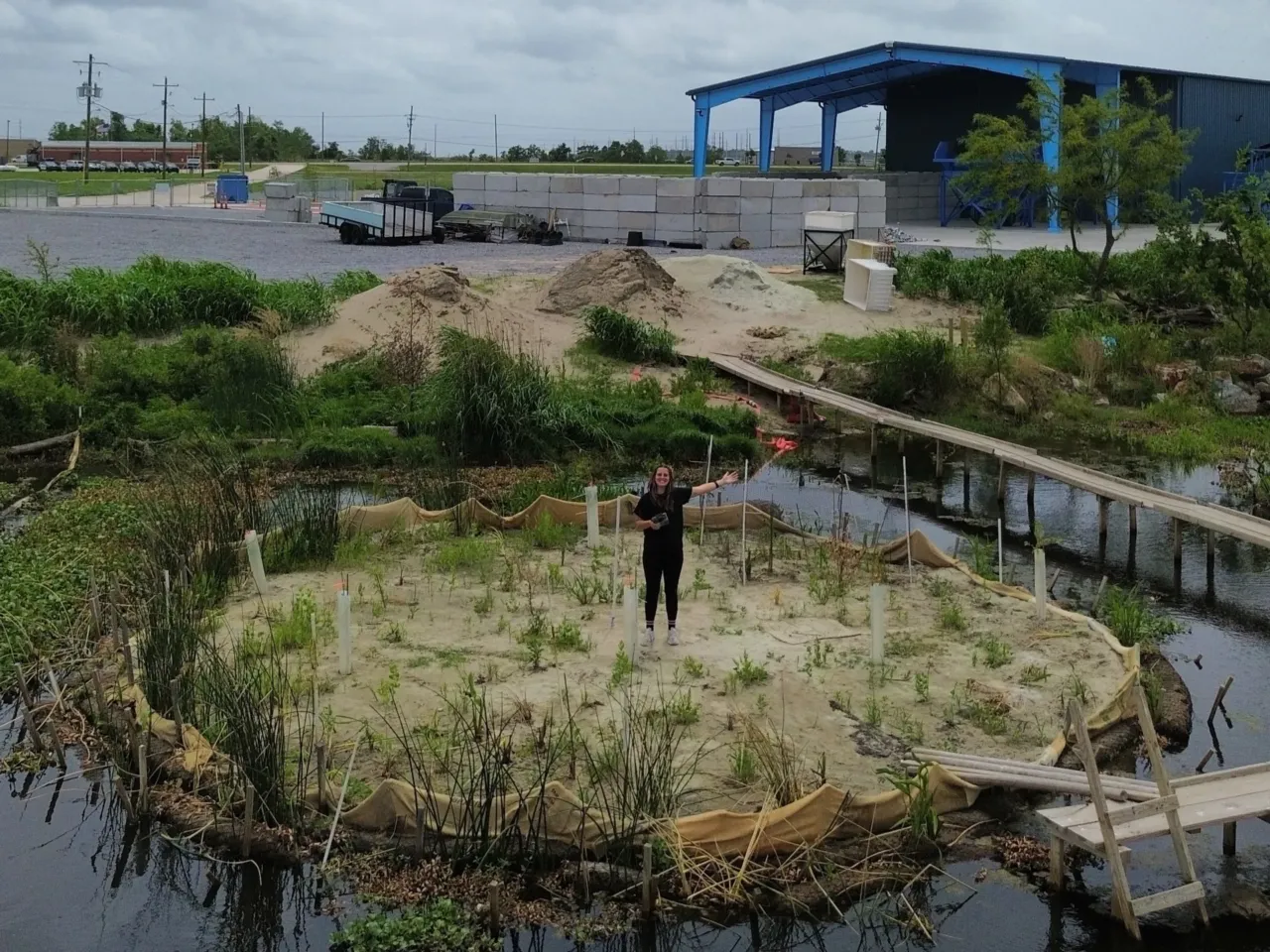 Louisiana's coast is eroding. One engineer found a fix in her wine bottle 3 Franziska Trautmann stands on Glass Half Full's sandbank made of recycled glass.