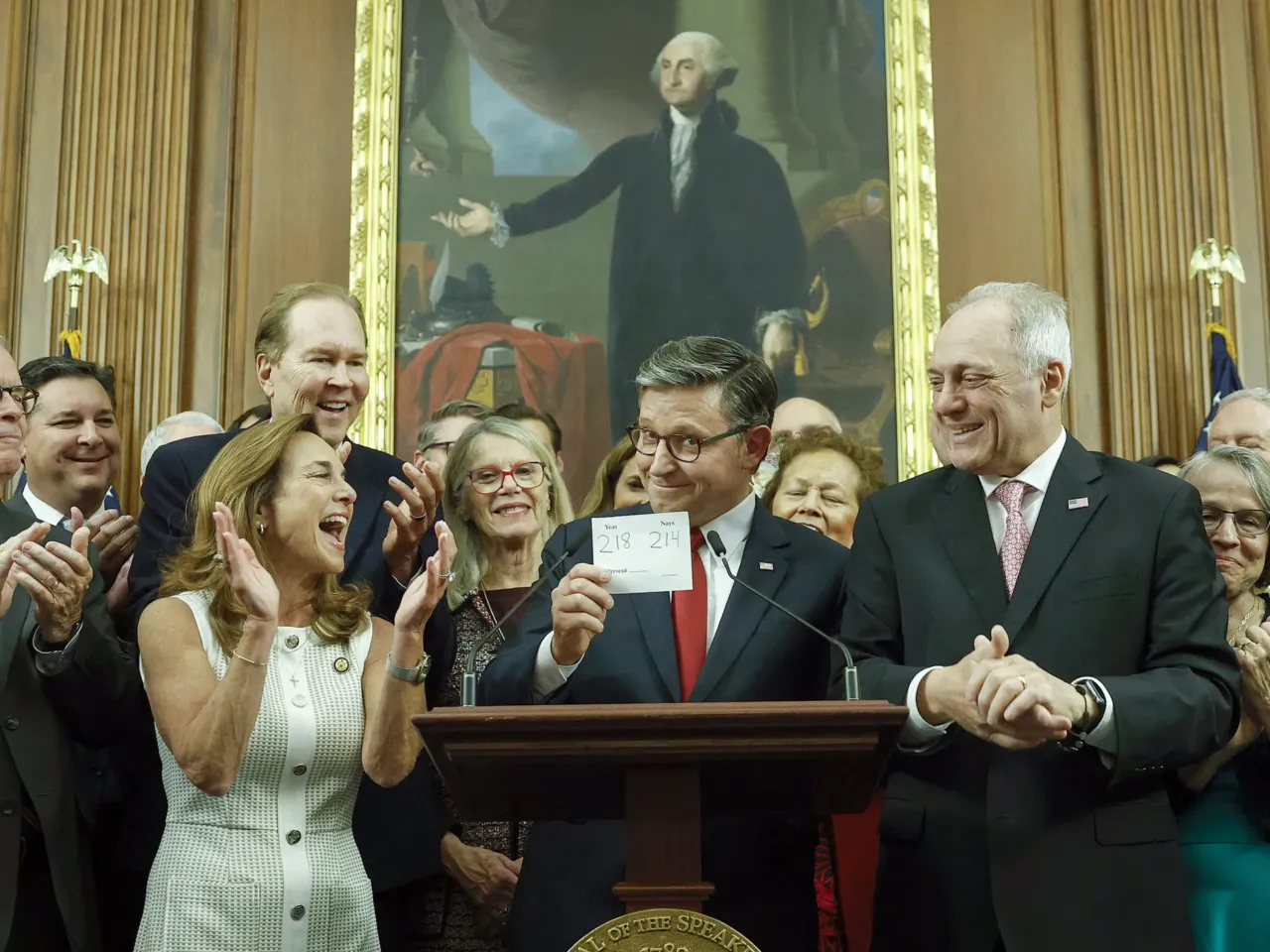 Speaker of the House Mike Johnson, R-La., holds up the vote total as he delivers remarks alongside fellow House Republicans after passing President Trump's sweeping domestic policy bill on Thursday.