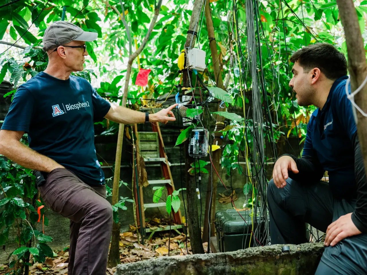 Inside the evolution of Biosphere 2, from '90s punchline to scientific playground 6 Eco hydrologist Justin Beslity and terrestrial bio manager Jason de Leeuw in the rainforest at Biosphere 2 on June 20, 2025, in Oracle, Ariz., U.S.
