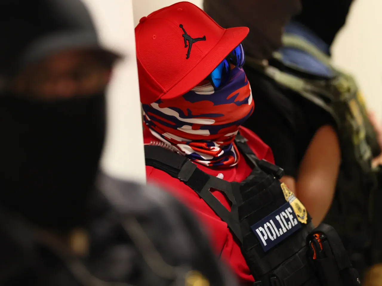Federal agents wearing masks patrol the halls of the immigration court at the Ted Weiss Federal Building in New York City on July 9.