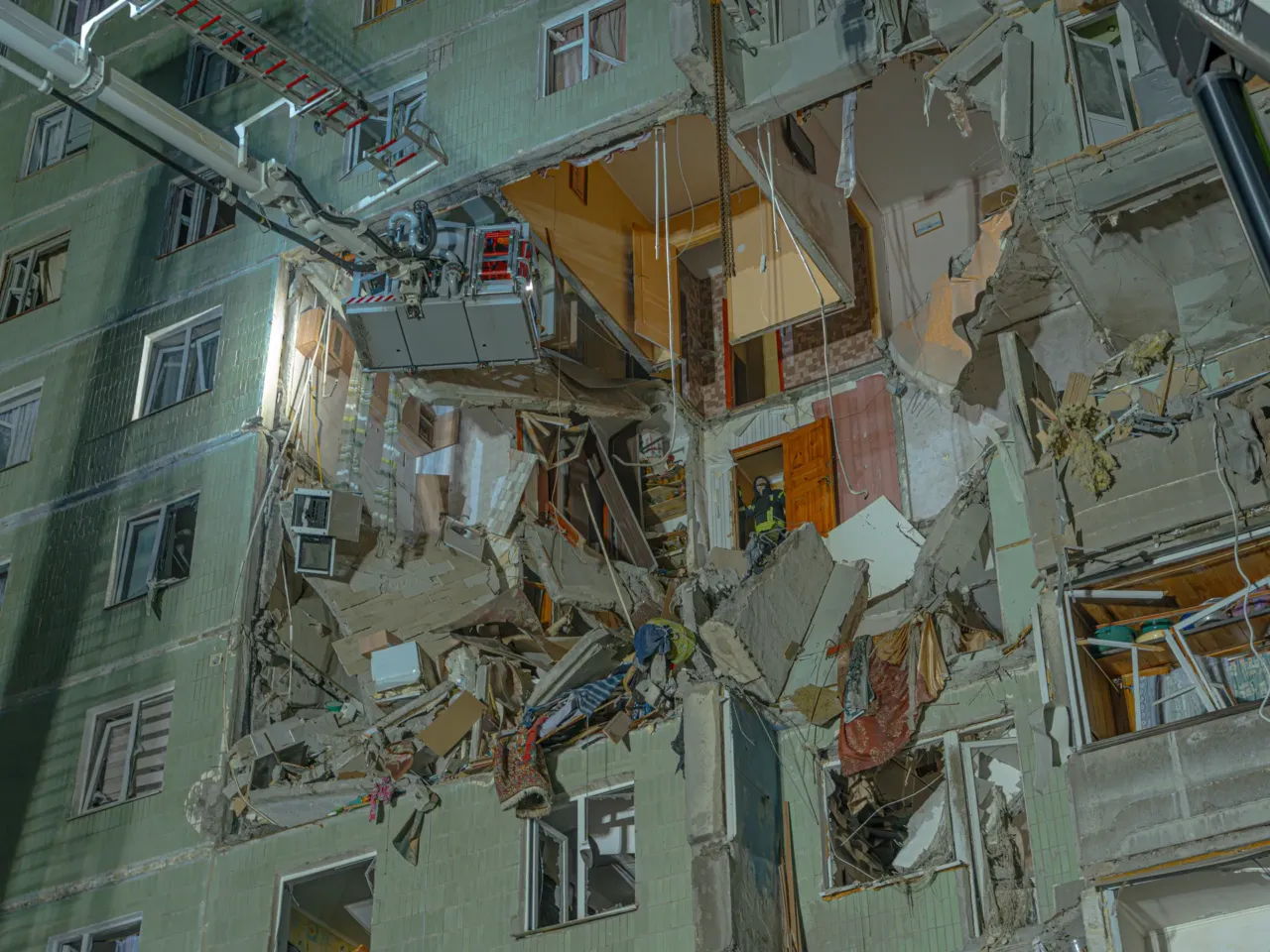 Sumy, a center of Ukrainian culture, lives in the crosshairs of a new Russian offensive 3 Emergency workers try to access a crushed apartment in the city of Sumy hit by an Iranian-designed attack drone launched by Russia. The attack early this year killed 11 people and injured 14.