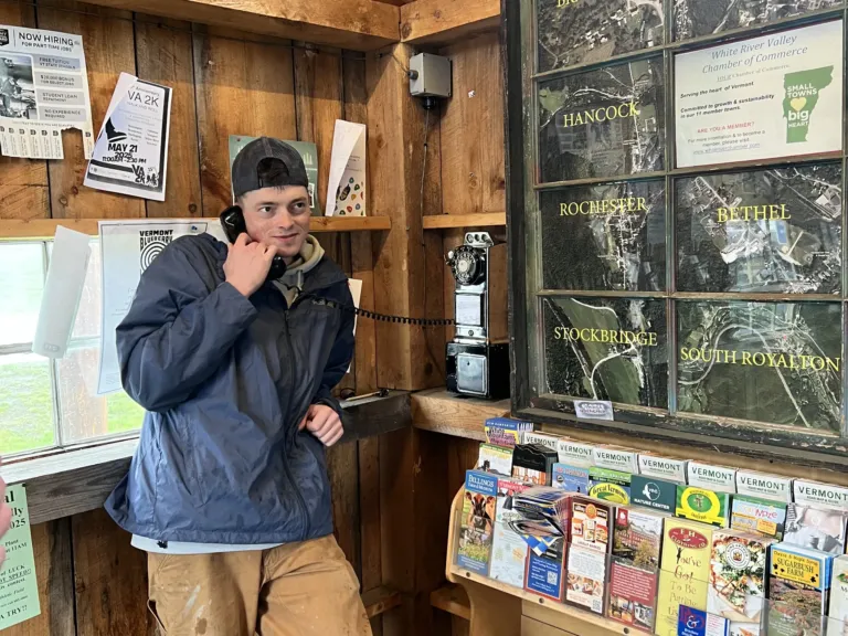 An engineer restores pay phones for free public use
