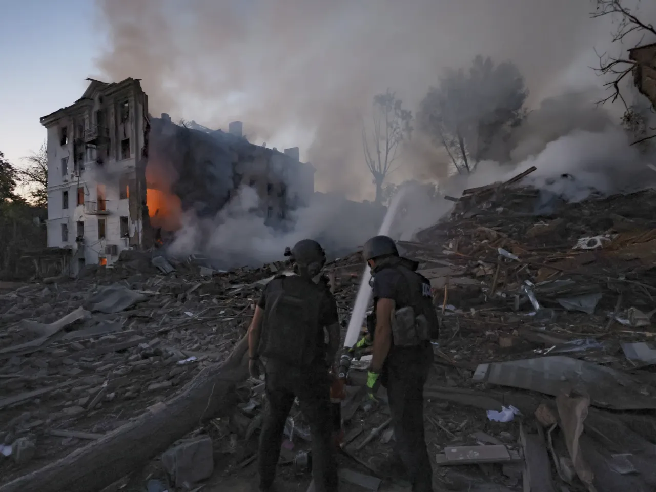 Trump is open to meeting with Putin for peace talks without Zelenskyy 2 Emergency services personnel work to extinguish a fire at a residential house destroyed by a Russian air strike on Kramatorsk, Ukraine, on July 31.