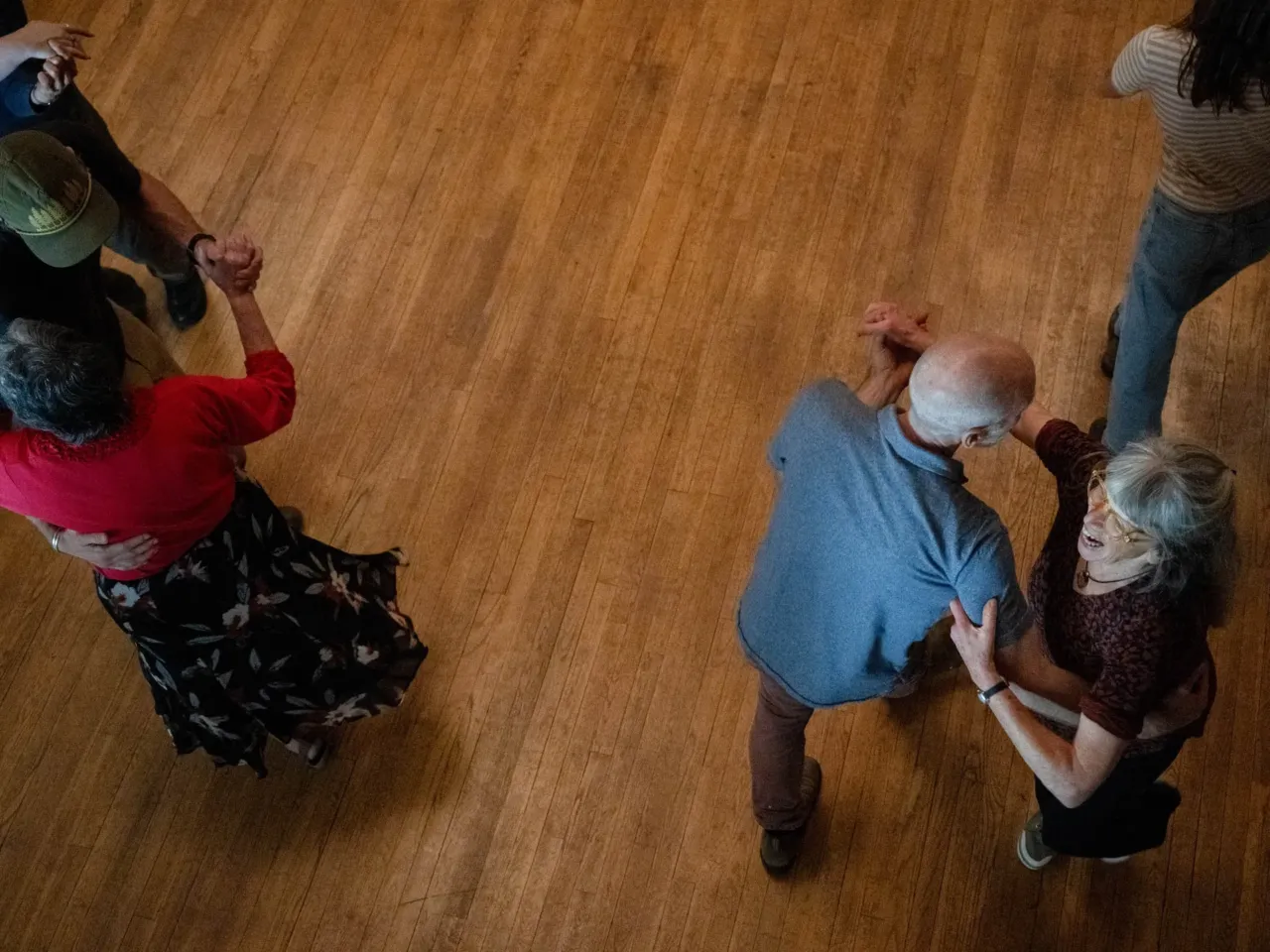 Here, together: Images of community from NPR station photographers 4 Annie Landenberger (bottom right) dances with Erik Jacobs during the election night square dance in Townshend, Vt., on Tuesday, Nov. 5, 2024, in the Townshend Town Hall.