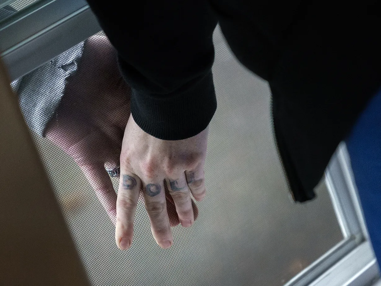 Here, together: Images of community from NPR station photographers 6 Unable to have visitors, Aleah and her boyfriend press their hands together, separated by the screen of an open window, as Aleah stays at Recovery Works Northwest's detox center.