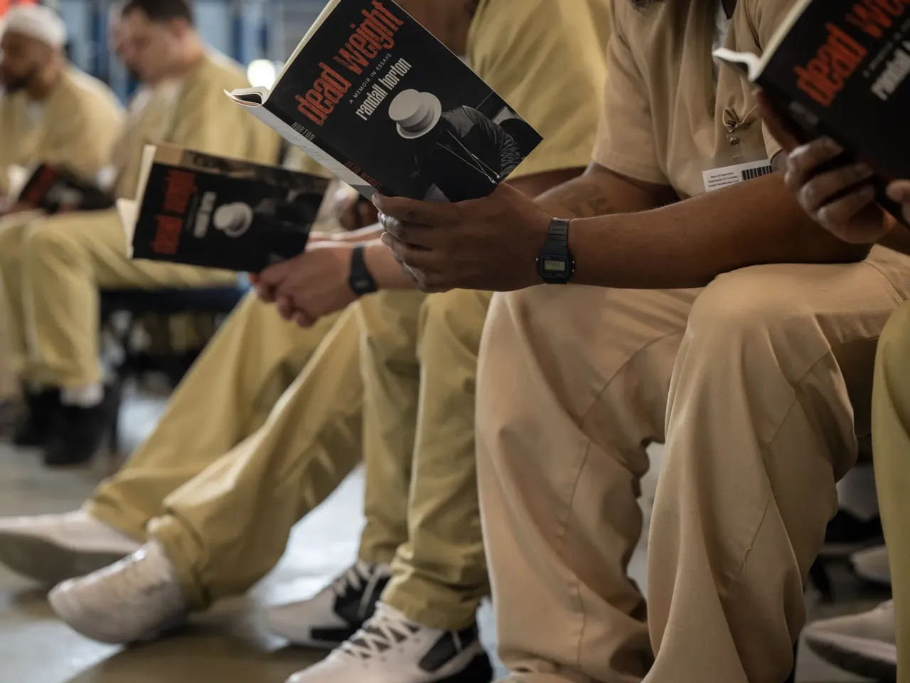 Here, together: Images of community from NPR station photographers 9 Inmates at Cybulski Community Reintegration Center in Enfield, Conn., receive books and listen to speakers as part of an event put on by Freedom Reads on May 1, 2025.