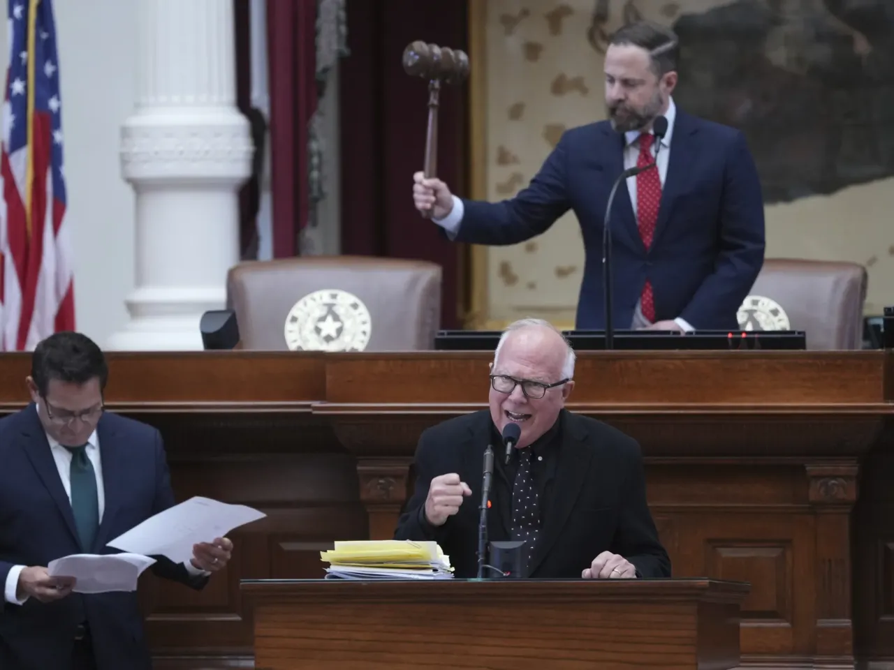 Texas passes midterm redistricting sought by Trump as California plans to counter 1 Texas state Rep. Todd Hunter, front right, answers questions during debate over a redrawn U.S. congressional map during a special legislative session on Wednesday in Austin.