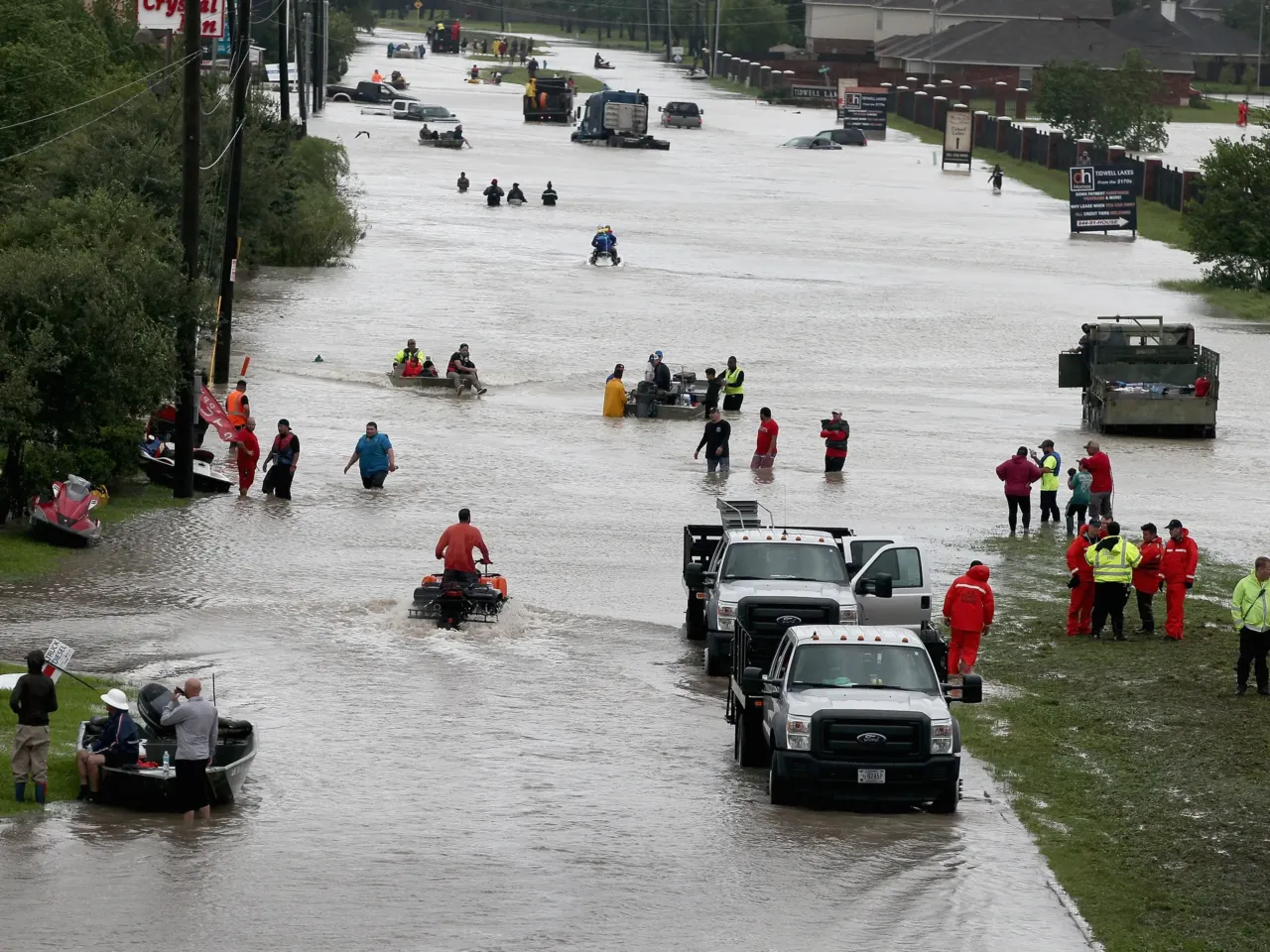 Hurricane science has come far since Katrina. That progress is now at risk 3 People make their way out of a flooded neighborhood in Houston after it was inundated with rain during 2017's Hurricane Harvey. The storm dumped feet of rain in and around Houston over several days. The flooding was worsened by climate change.