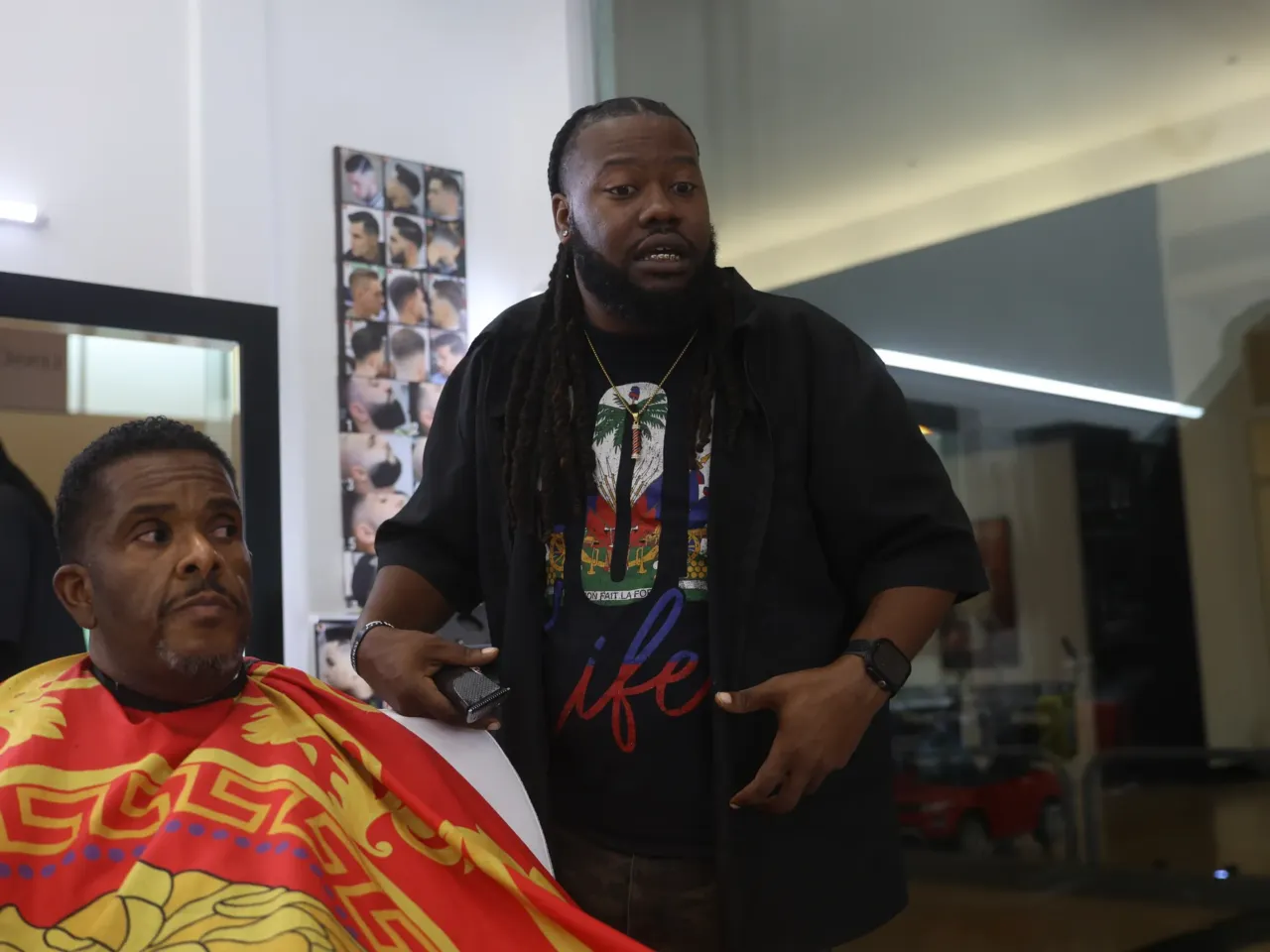 After Hurricane Katrina, evacuees changed Houston and the city changed them 4 John "Speedy" Riddle pauses Jermaine Moore's haircut to discuss his life in Houston after Hurricane Katrina.