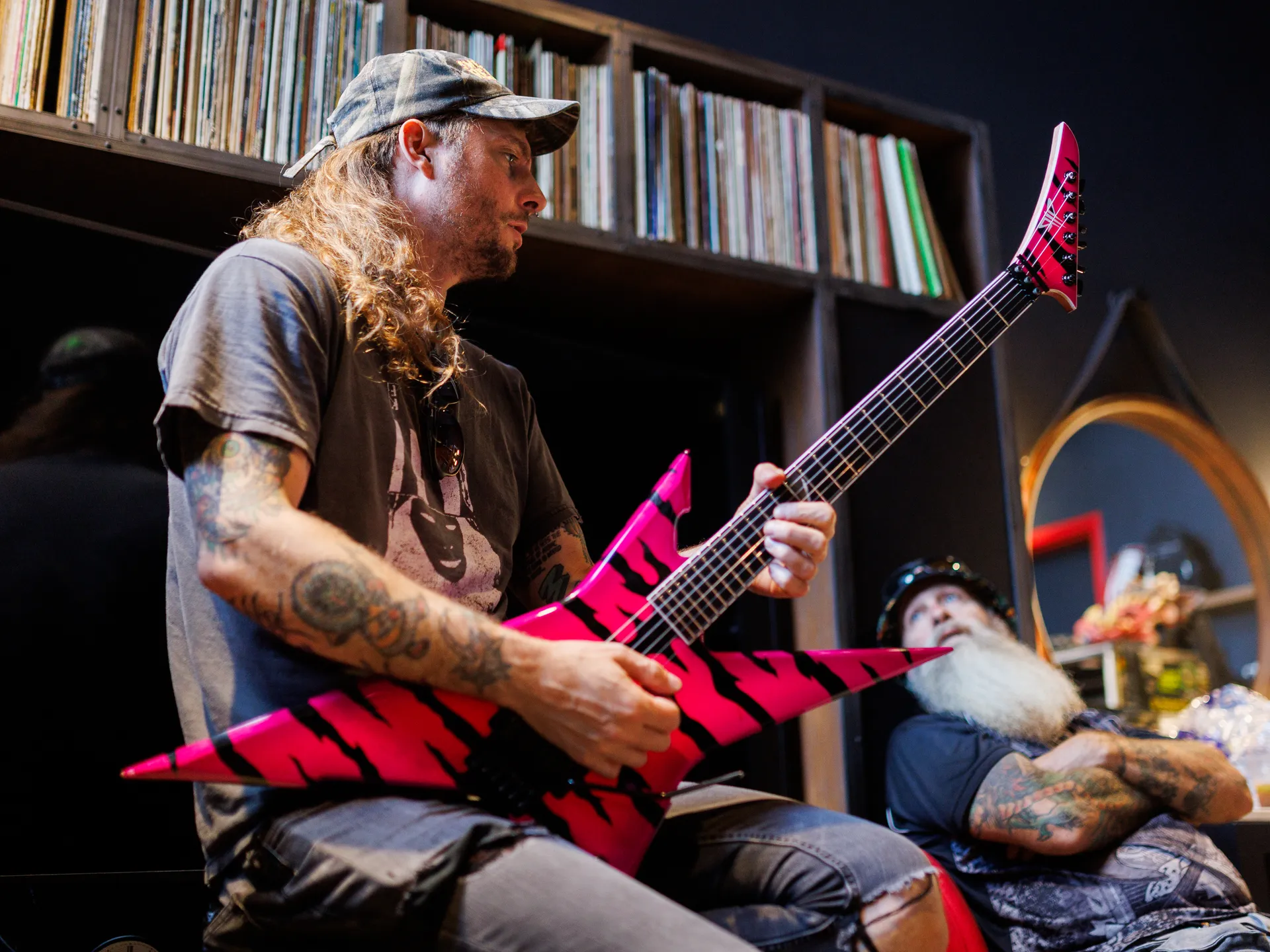 Joy and happiness radiate when GWAR and Lamb of God return to Richmond 10 Tommy Meehan, Grodius Maximus' human thrall, plays a guitar as he chats with Ronnie Cook, a friend of GWAR, before GWAR performed a set at Allianz Amphitheater before headliner Lamb of God took the stage on Thursday, July 24, 2025 in Richmond, Virginia. It was an inaugural performance for both bands at the venue, which is in its first year of being open.