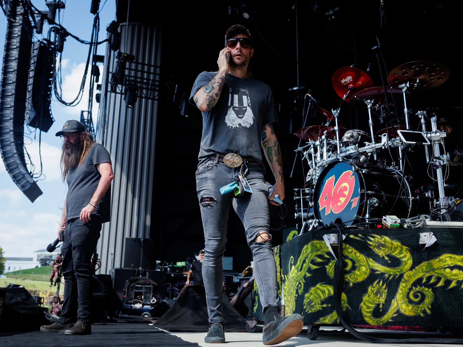 Joy and happiness radiate when GWAR and Lamb of God return to Richmond 13 Tommy Meehan, Grodius Maximus' human thrall, speaks on the phone as he joins Jesse Phillips, a GWAR crew member, for GWAR's soundcheck ahead of their performance on July 24, 2025 in Richmond.