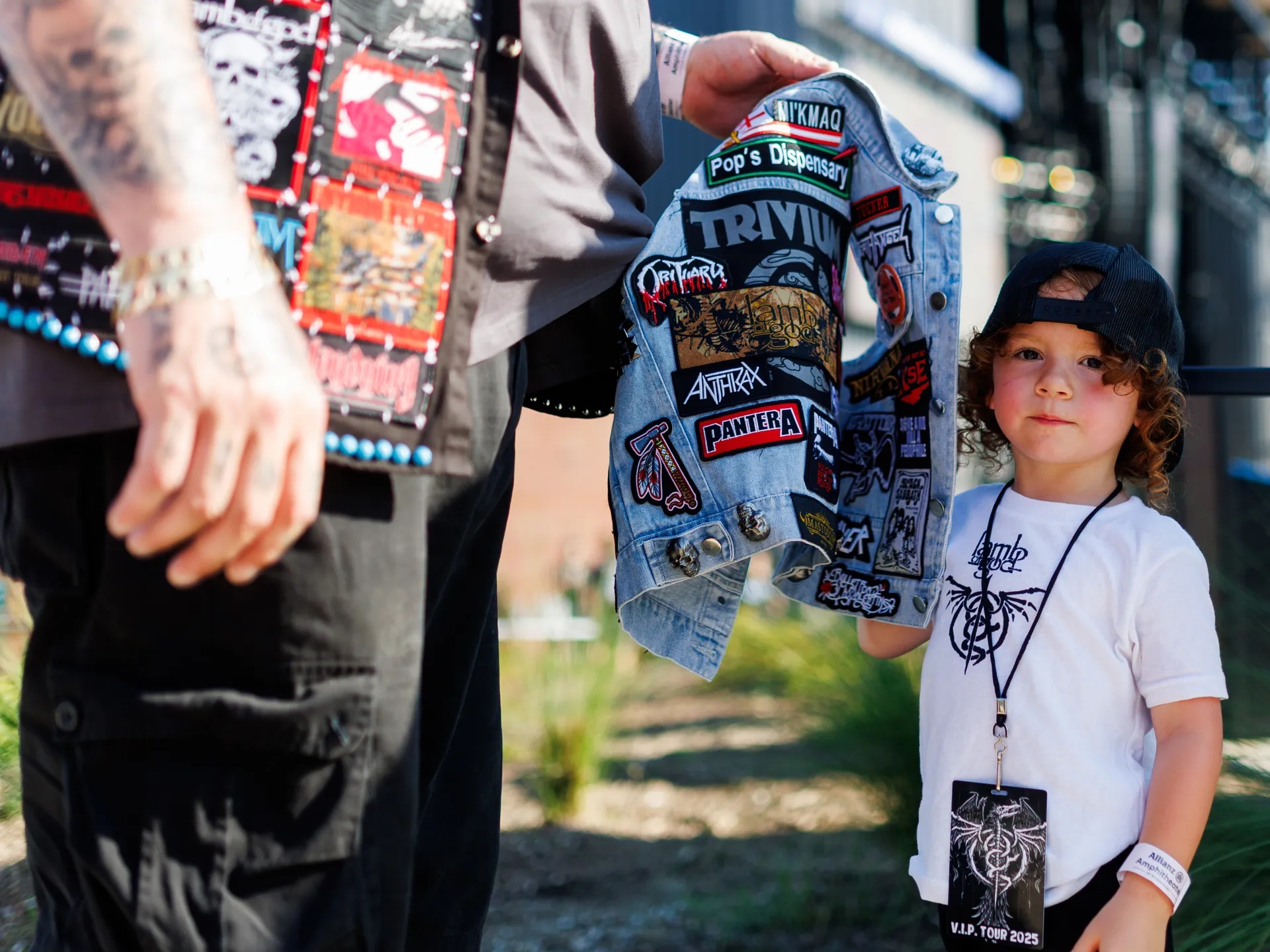 Joy and happiness radiate when GWAR and Lamb of God return to Richmond 19 Tim Wysote, who traveled from Quebec to see Lamb of God, helps his three-year-old son put on his jacket before a performance at Allianz Amphitheater in Richmond on July 24, 2025.