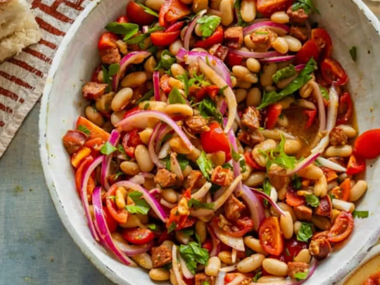 White beans and chorizo with quick-marinated tomatoes and onions are a delicious way to say goodbye to summer.