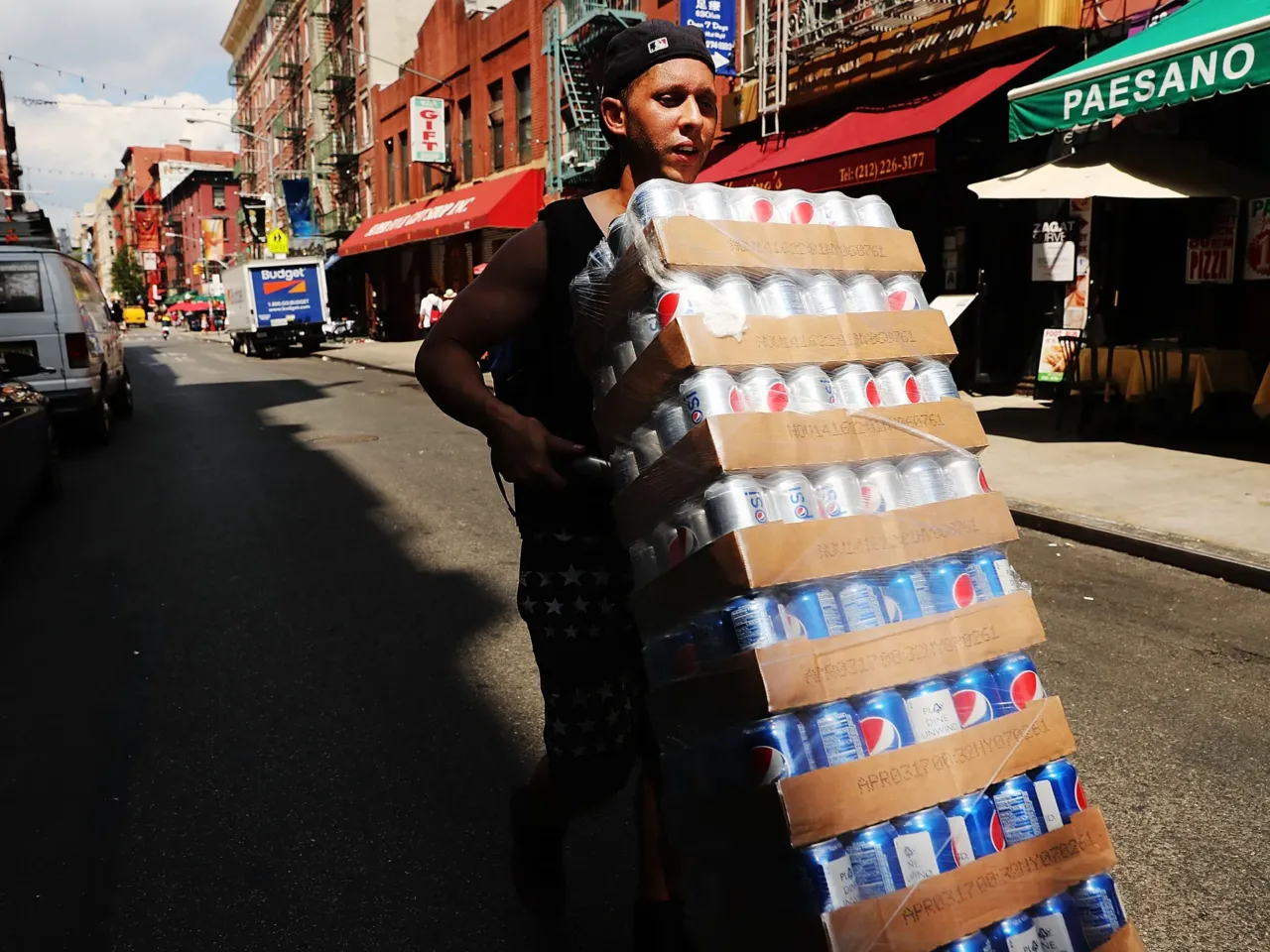 Demand for sugary beverages goes up when it's hot out. Here, delivering soda on a hot July day in New York City in 2016.