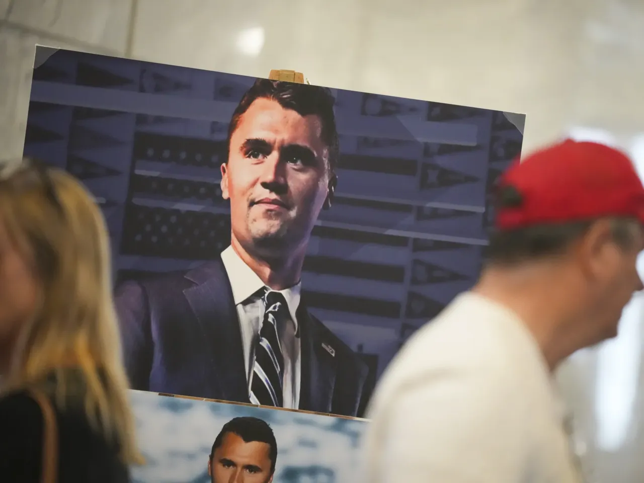Charlie Kirk's assassination sparks grief and rage online 1 A photo of Charlie Kirk is displayed during the vigil at the Utah Capitol in Salt Lake City following the killing of the conservative activist.
