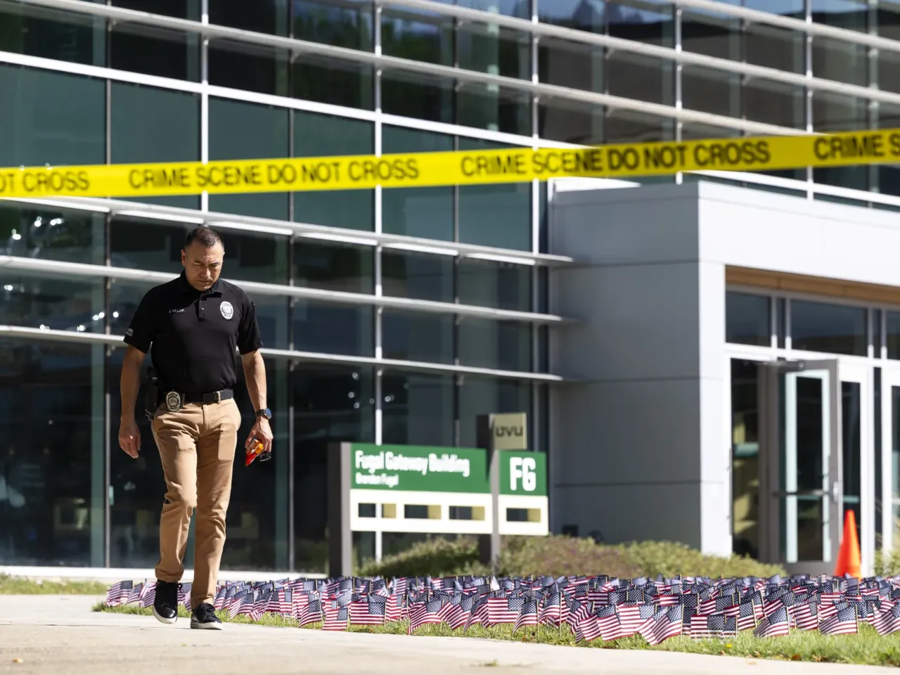 A police officer walks out of a building at Utah Valley University as authorities investigate the fatal shooting of political activist Charlie Kirk. Conservative influencers have reacted with grief and anger to Kirk's killing.
