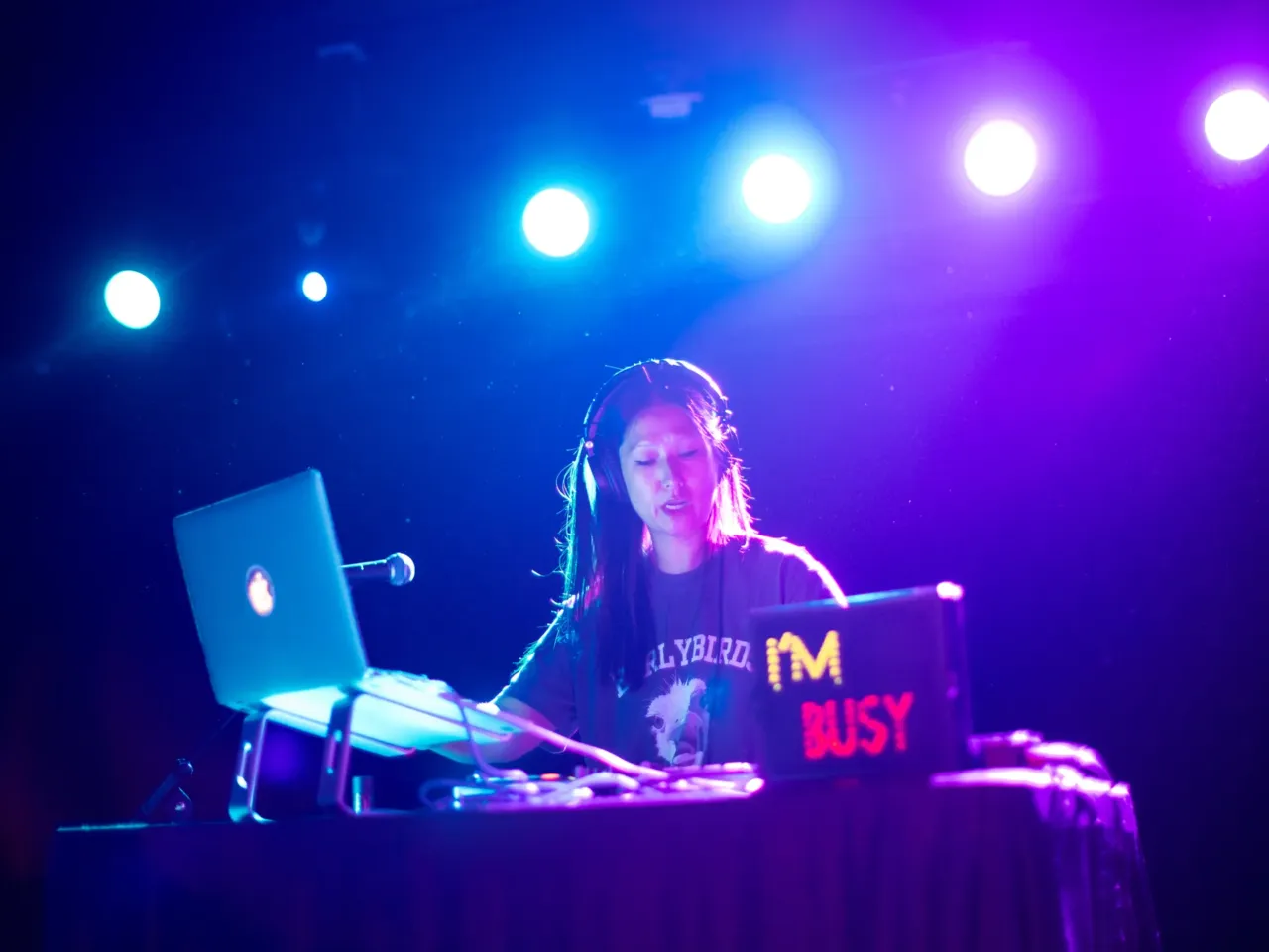 Helean Lee, DJ and Music Director of Earlybirds Club, plays music on stage.