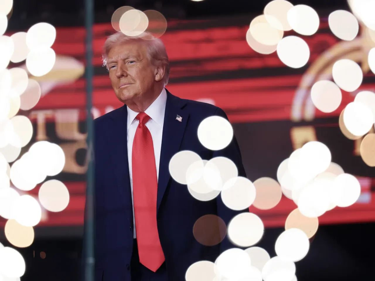 President Donald Trump walks onstage during the memorial service for conservative political activist Charlie Kirk.