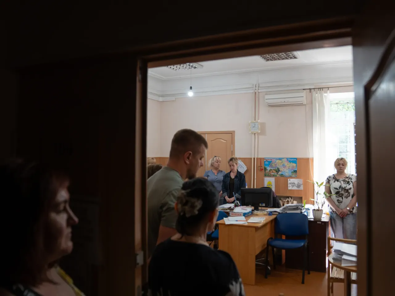 How to reintegrate over a million veterans? Groups in Ukraine are working on it 8 A group of people in Samar, a small city in the Dnipro region where psychologist Yuliia Krat has begun her trainings, stands for a minute of silence in memory of people that have died in the war at 9 a.m. every day.