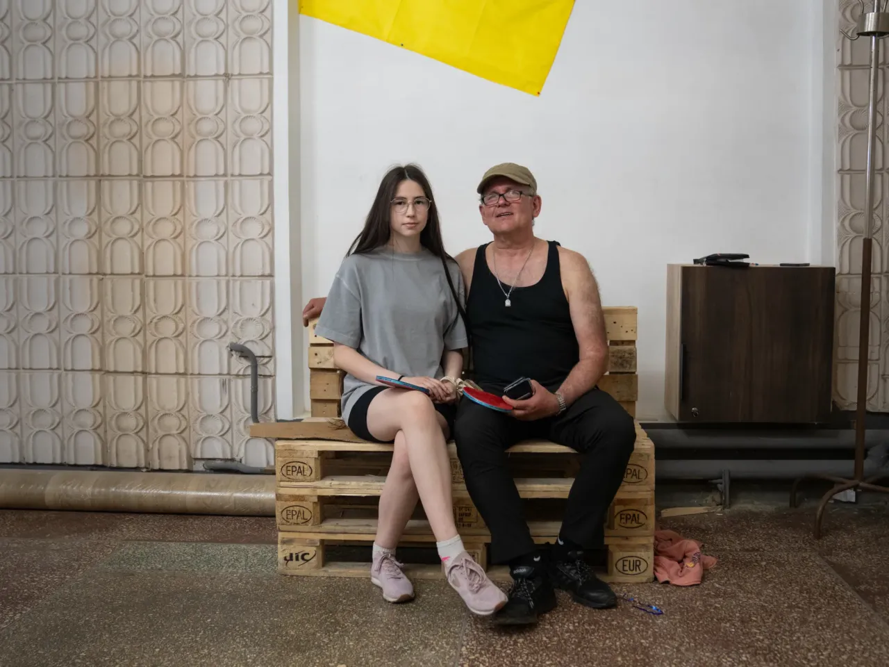 How to reintegrate over a million veterans? Groups in Ukraine are working on it 11 Arina Melnykov and her father Andriy sit together after playing table tennis with other veterans.
