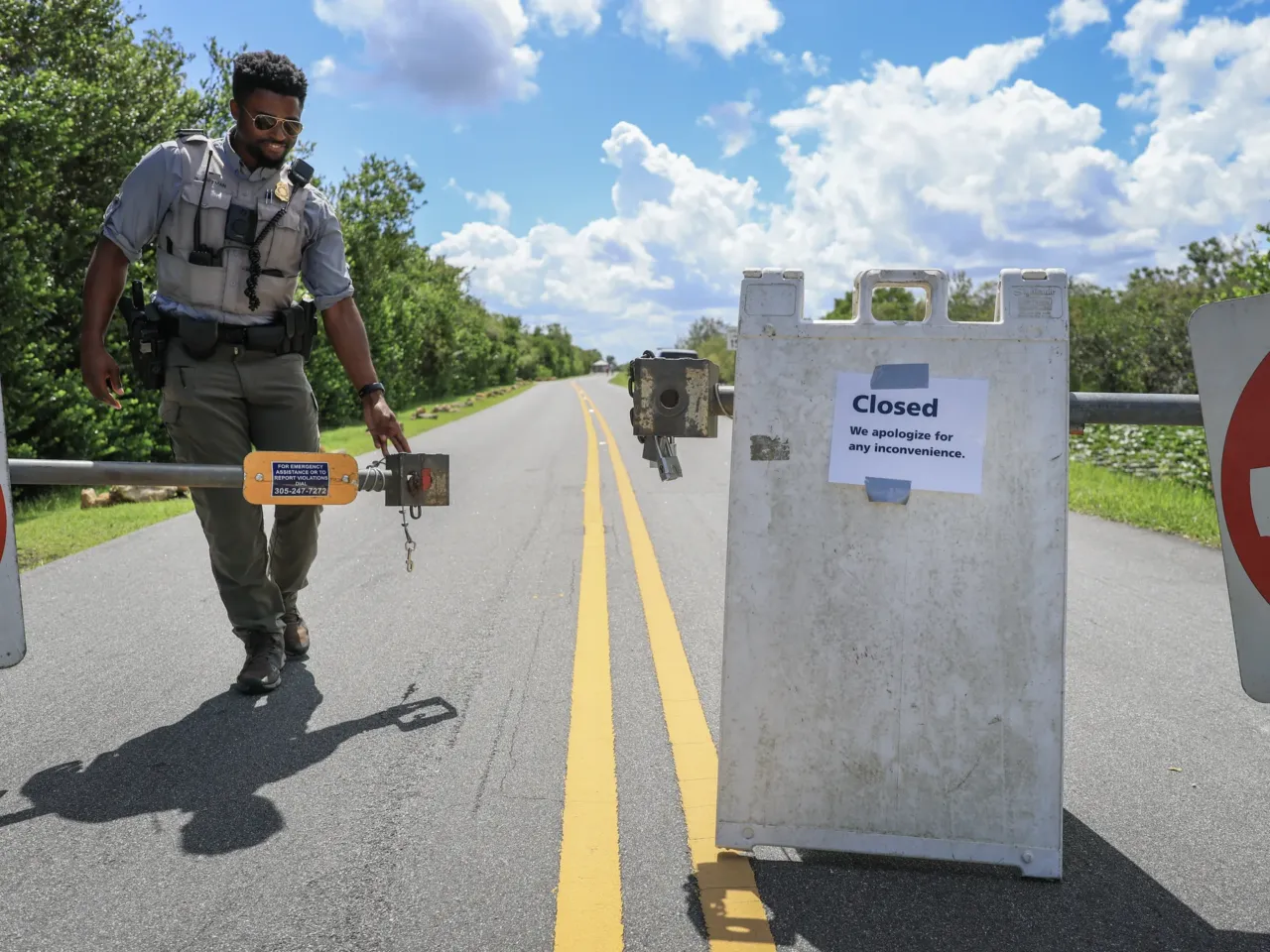 The federal government is still shut down. Here's what that means across the country 5 Greg Freeman, a National Park Service ranger closes the entrance gate due to the government shutdown at the Everglades National Park Shark Valley on Oct. 1 in Florida. Shark Valley remains open to visitors who park outside the entrance gate and walk in, although with limited staffing.