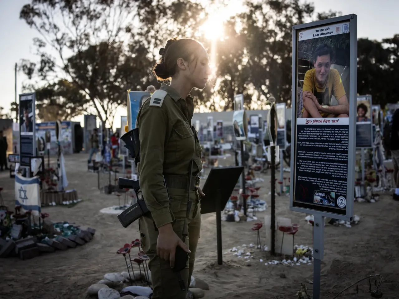 The costs of Israel's longest war, for Israelis 2 An Israeli army soldier stands before the memorial of a victim of the Oct. 7, 2023, attacks at the Nova Festival grounds in Reim, in southern Israel, on the second anniversary of the attacks on Tuesday.