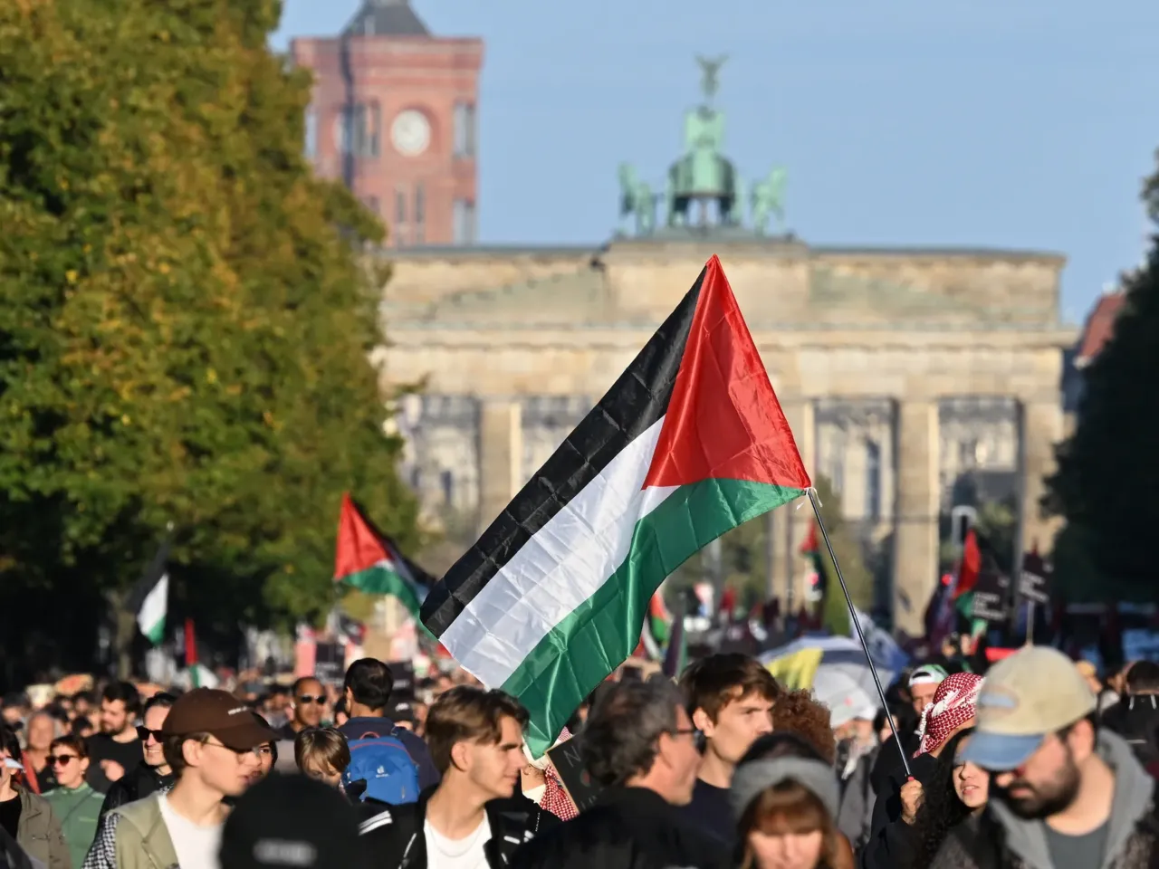 The costs of Israel's longest war, for Israelis 3 Protesters march with Palestinian flags during a demonstration under the motto "Draw the red line with us: Together for Gaza!" near the Brandenburg Gate in Berlin, on Sept. 27. Tens of thousands of demonstrators marched through the streets of the German capital to demand that Israel halt its military campaign in Gaza.