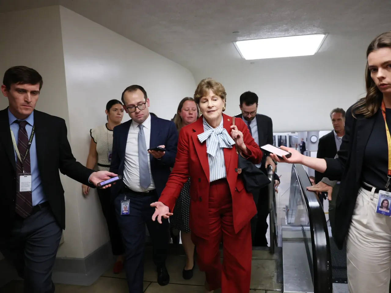 Sen. Jeanne Shaheen, D-N.H., speaks to reporters as she walks through the Senate subway in the U.S. Capitol on Sept. 30, 2025, in Washington.