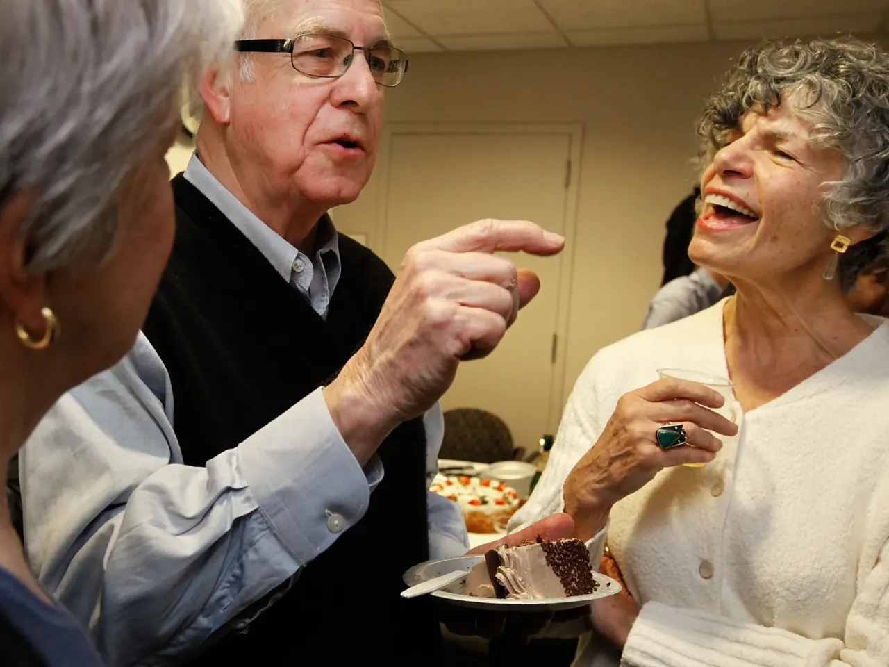 Carl Kasell talks with Susan Stamberg (right) and Linda Wertheimer after delivering his last newscast at NPR on Dec. 30, 2009 in Washington, D.C.