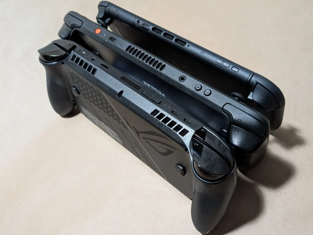 ROG Xbox Ally X sells out, despite disdain for shifts in Microsoft's gaming strategy 2 A comparison of the thickness of handheld gaming devices, from the Xbox Ally X (bottom), the OLED Steam Deck (middle), and the Nintendo Switch 2 (top).