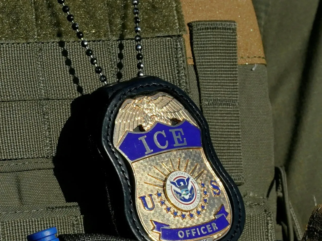 Camouflaging cars and swapping license plates: How agents make immigration arrests 1 File image from May 7, 2025 in Newark, N.J., shows a badge hanging over the uniform of an Immigration and Customs Enforcement (ICE) agent.
