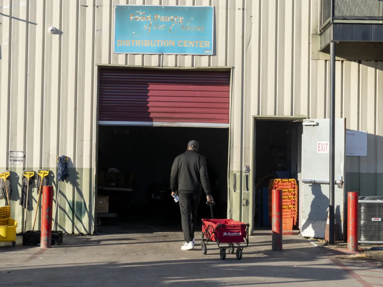 A person walks into a food distribution event at Giving Hope food pantry in New Orleans, La., on Saturday, November 1, 2025.
