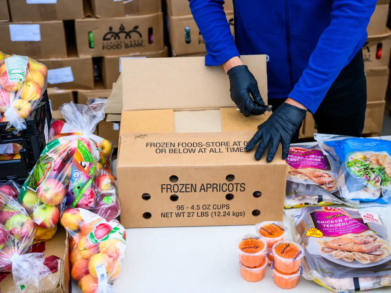 The federal government is still shut down. Here's what that means across the country 3 A volunteer prepares to distribute a box of donated food items to a furloughed federal worker at a Capital Area Food Bank distribution site in Hyattsville, Md., on Nov. 4.