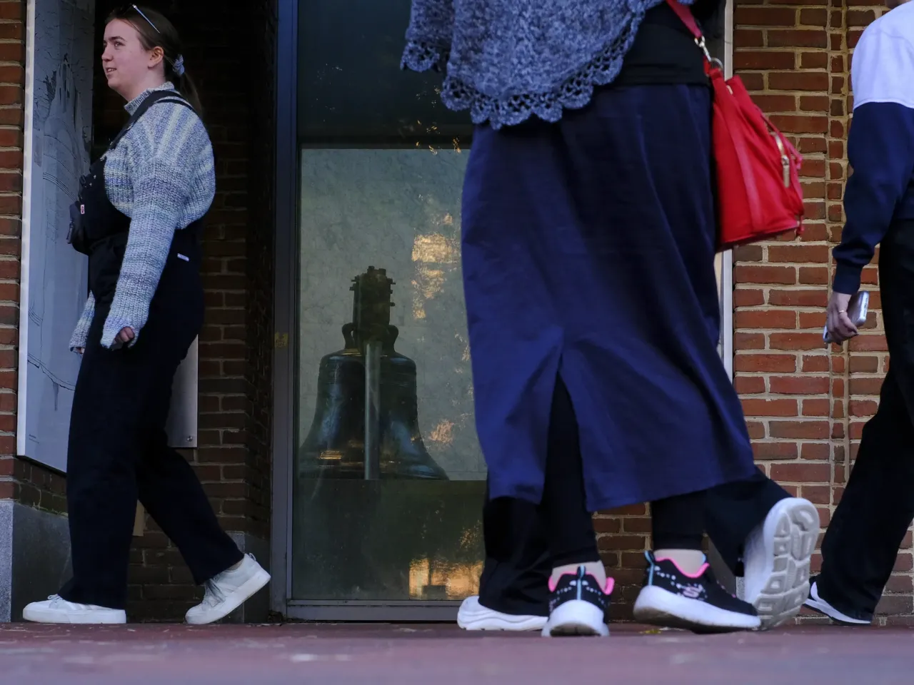 The federal government is still shut down. Here's what that means across the country 7 Visitors look at the Liberty Bell from outside the Liberty Bell Center because of the U.S. government shutdown in Philadelphia on Oct. 24.