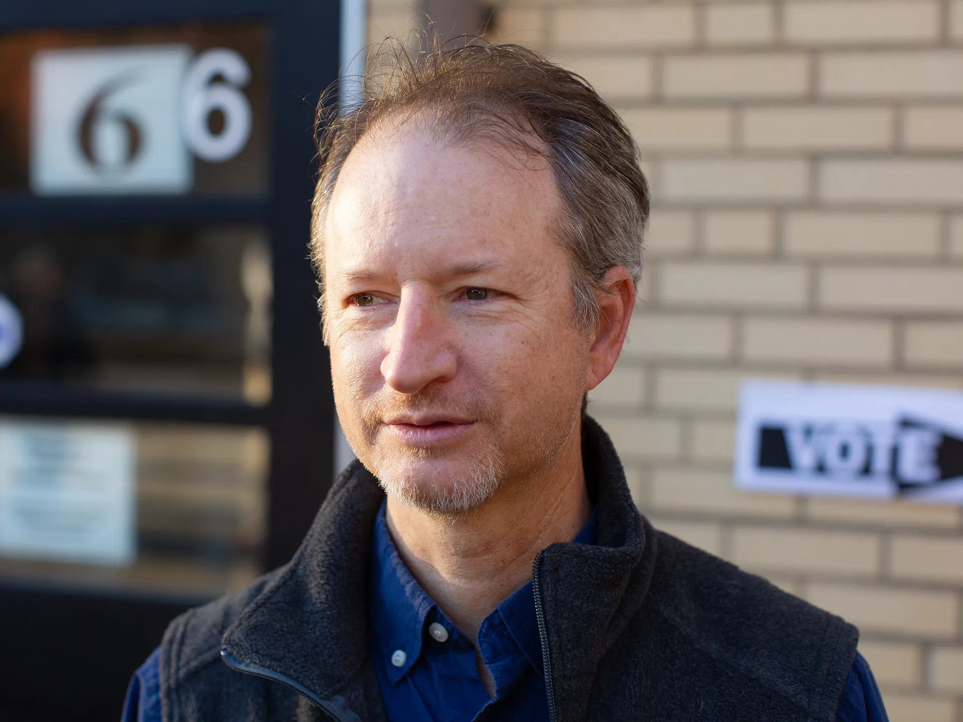 Photo essay: Amid historic election, Virginians long for change 14 Ryan K. Smith, a history professor at Virginia Commonwealth University, is photographed after voting.