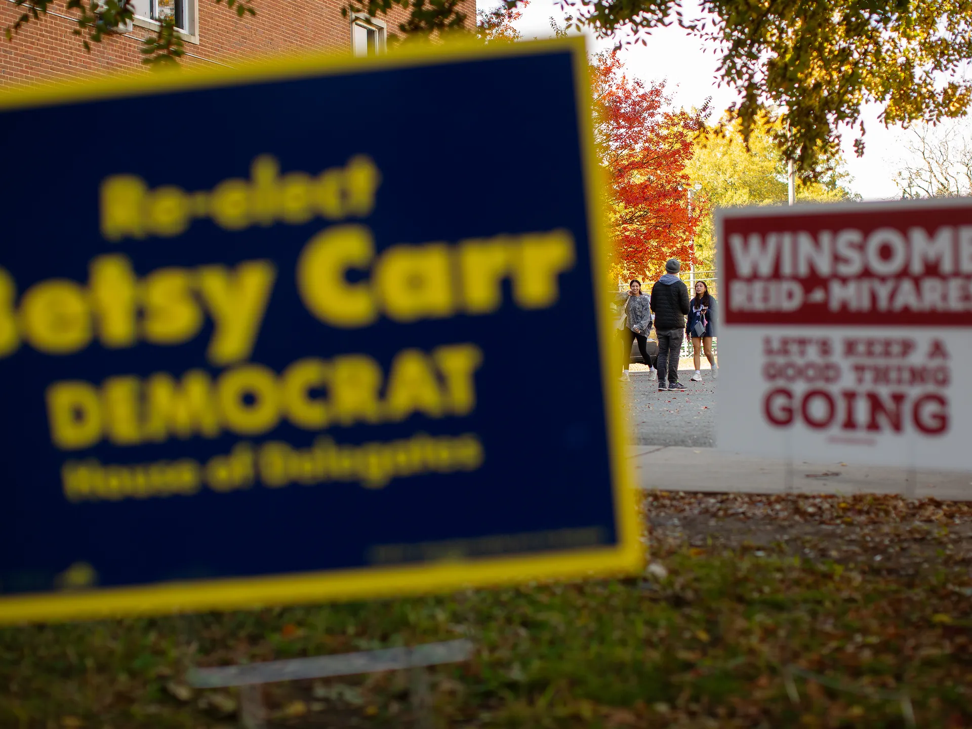 Photo essay: Amid historic election, Virginians long for change 18 A Spanberger campaign volunteer talks to young voters on their way into the Randolph Community Center precinct as he hands out sample Democratic Party ballots on Nov. 4, 2025.