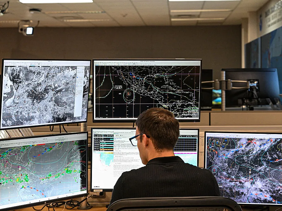 Countries are gathering for climate negotiations. Here's where the U.S. stands 3 A tropical analysis meteorologist works at his station at the National Oceanic and Atmospheric Administration's National Hurricane Center in Miami, Florida, in May 2025. Earlier this year, the Trump administration fired hundreds of NOAA staff and deleted government websites with data on weather and climate.
