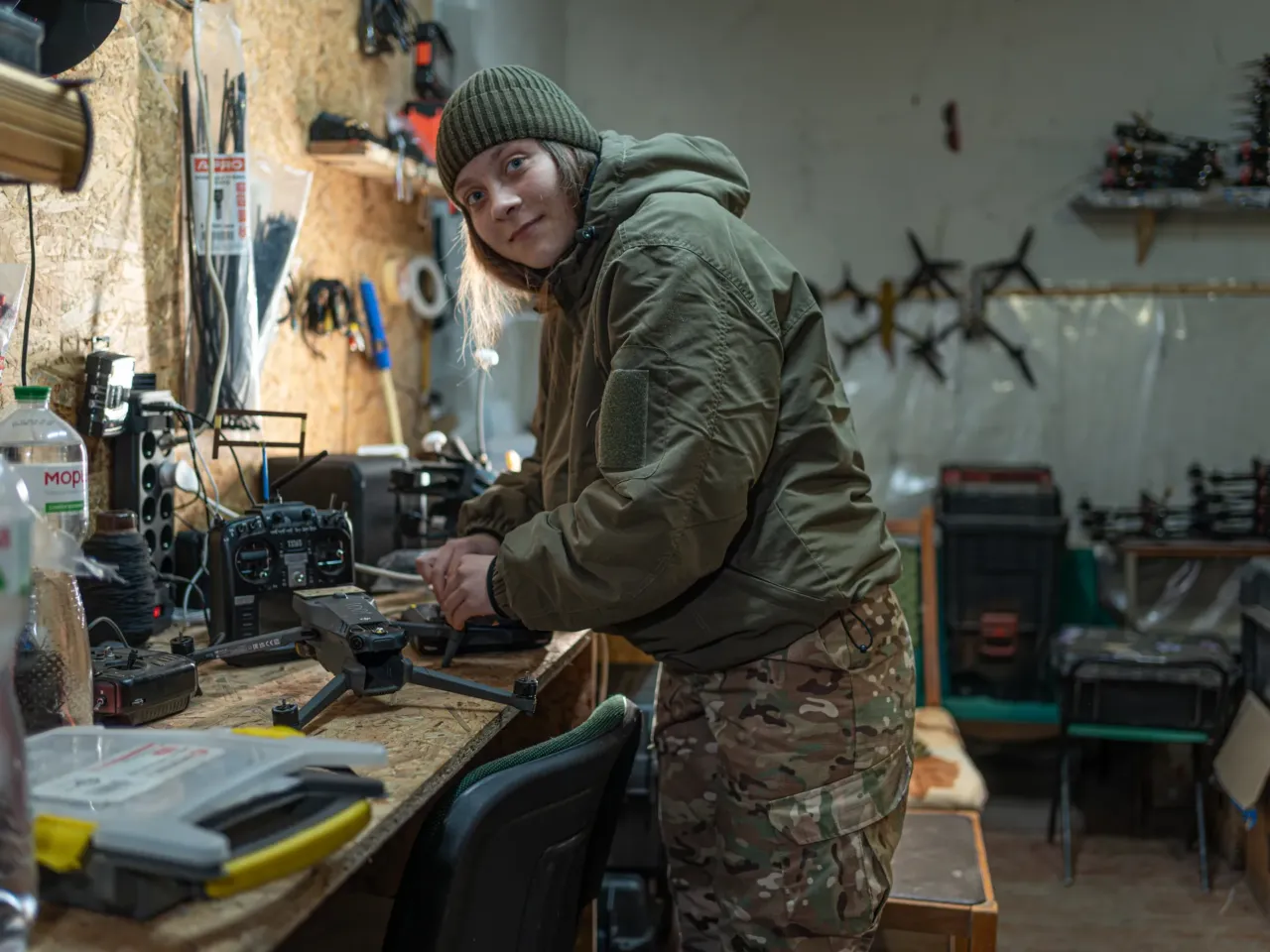 'No turning back': More and more Ukrainian women join the army to fight Russia 2 Yevhenia, 19, a reconnaissance drone pilot of the Khartiia 13th National Guard Brigade, works in a drone workshop in northeastern Ukraine earlier this year.