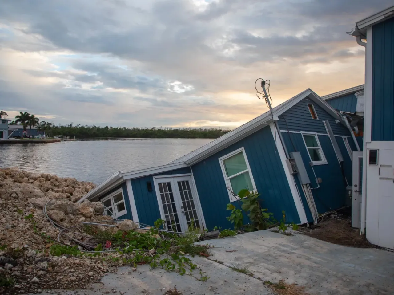 It's harder to get home insurance. That's changing communities across the U.S. 5 Hurricane Ian caused massive damage in Florida, and led insurers to pull out of the area or raise prices dramatically. Unaffordable and unavailable home insurance is forcing some people to leave. Here, a damaged home in Matlacha, Fla. seen nearly two years after the storm.