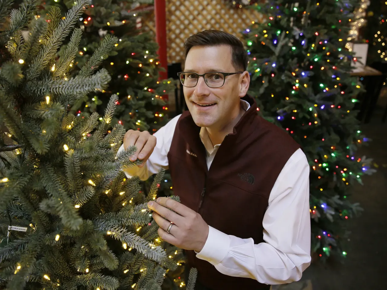 Your artificial Christmas tree will cost more this year, thanks in part to tariffs 1 In this photo, Balsam Brands founder and CEO Mac Harman poses with artificial Christmas trees at the Balsam Hill Outlet store in Burlingame, Calif.