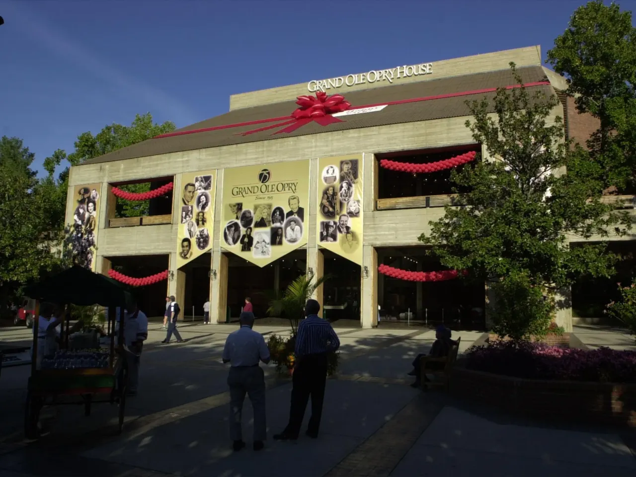 In 1974, the Opry moved from the Ryman Theater to The Grand Ole Opry House in Nashville, Tenn. Shown here in 2000, during a celebration for the venue's 75th birthday, it was originally located within a theme park called Opryland USA. Today it is adjacent to Opry Mills, a shopping mall.