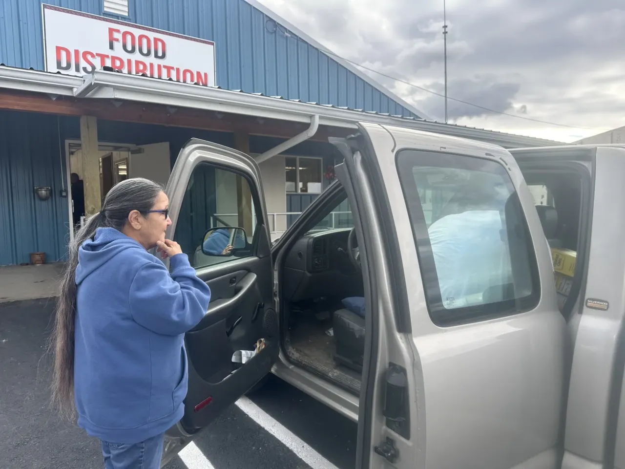 SNAP was restored, but many indigenous Americans still struggle with food insecurity 1 Mary Lefthand watches as workers at the commodity warehouse load food into her truck in St. Ignatius, Montana.