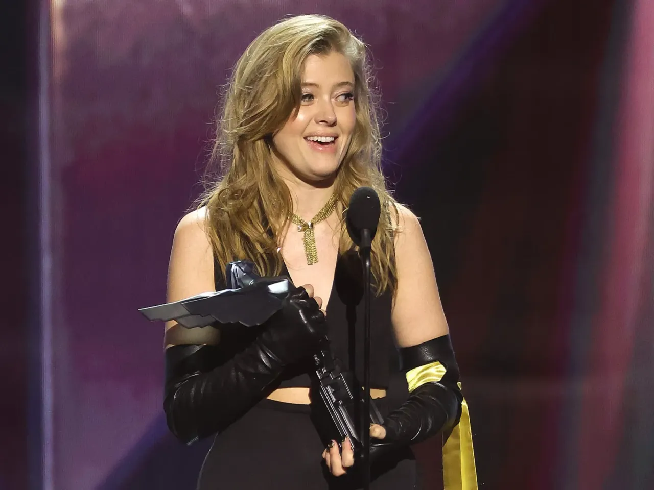 Jennifer English, also known for her leading role in 2023 Game of the Year winner Baldur's Gate 3, accepts her best performance award onstage at the Peacock Theater on December 11, 2025.