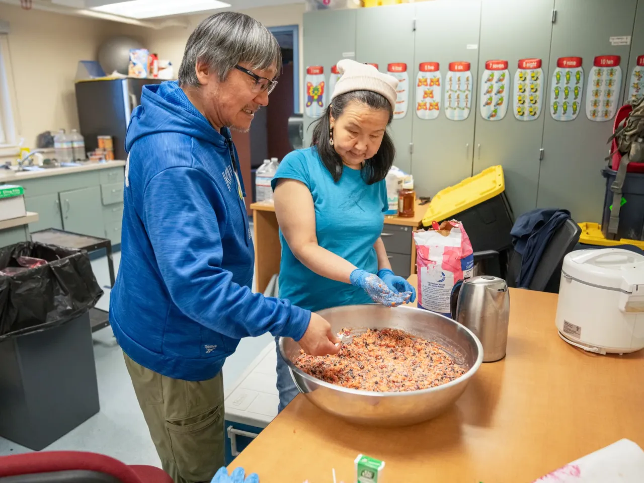Houses floated away in this Alaska Native village. Now residents want to move 4 Darrell John tastes some Alaskan ice cream, a desert of Crisco, sugar and frozen salmonberries, made by Nettie Igkurak at the Kwigillingok School. The school is serving as a shelter while people need a place to stay in Kwigillingok, though most residents have already relocated.
